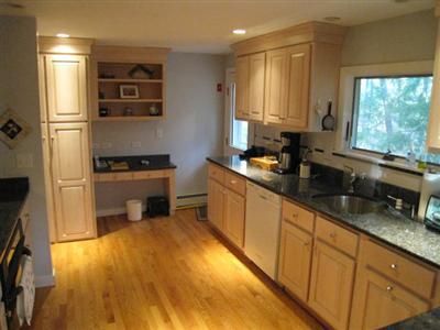 45 Cranberry Hollow Road Wellfleet, MA 02667 - Photo 13 of 26 a kitchen with stainless steel appliances granite countertop a sink stove and refrigerator