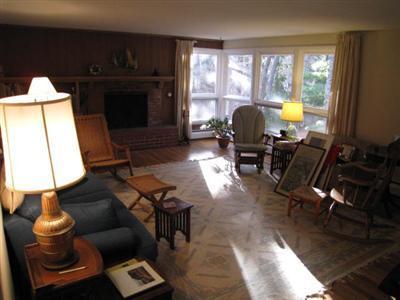 45 Cranberry Hollow Road Wellfleet, MA 02667 - Photo 20 of 26 a living room with furniture and a fireplace