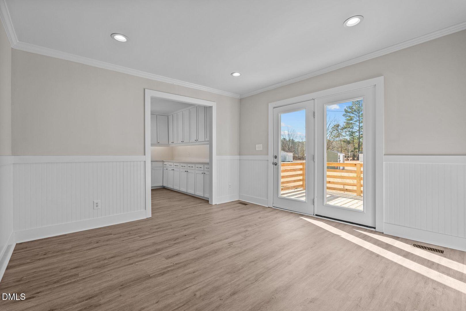 1920 Green Path Road Dunn, NC 28334 - Photo 12 of 30 an empty room with wooden floor closet and windows