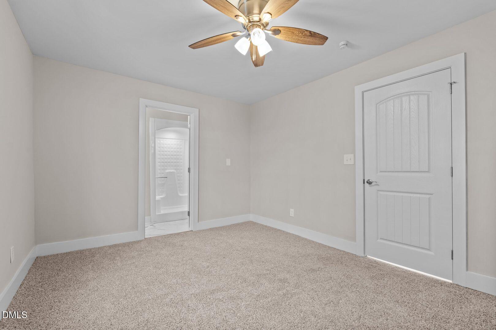 1920 Green Path Road Dunn, NC 28334 - Photo 16 of 30 an empty room with closet and a chandelier fan
