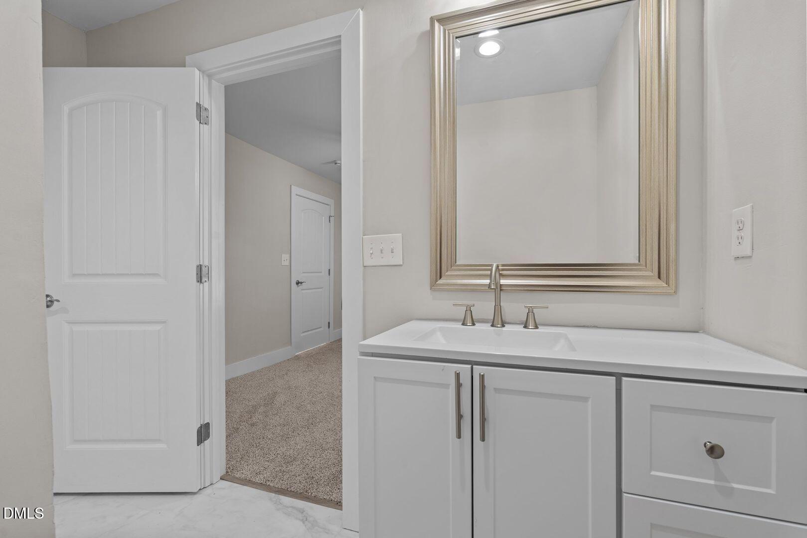 1920 Green Path Road Dunn, NC 28334 - Photo 18 of 30 a bathroom with a sink and a mirror