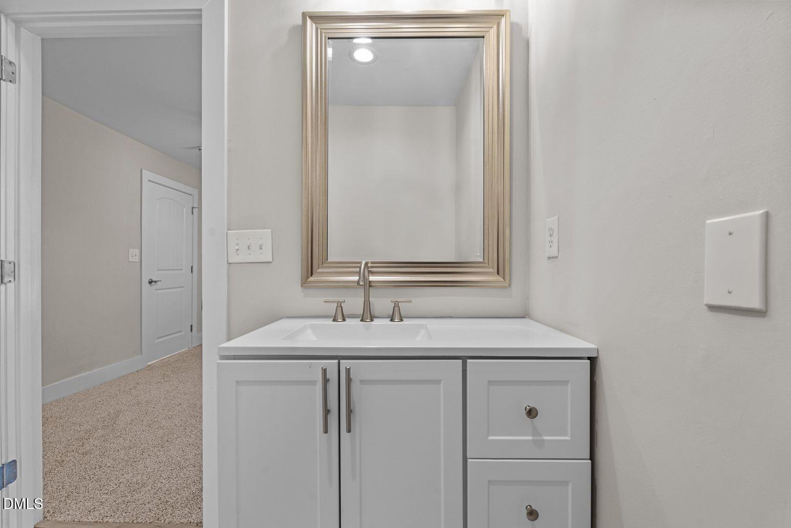 1920 Green Path Road Dunn, NC 28334 - Photo 19 of 30 a bathroom with a sink and a mirror