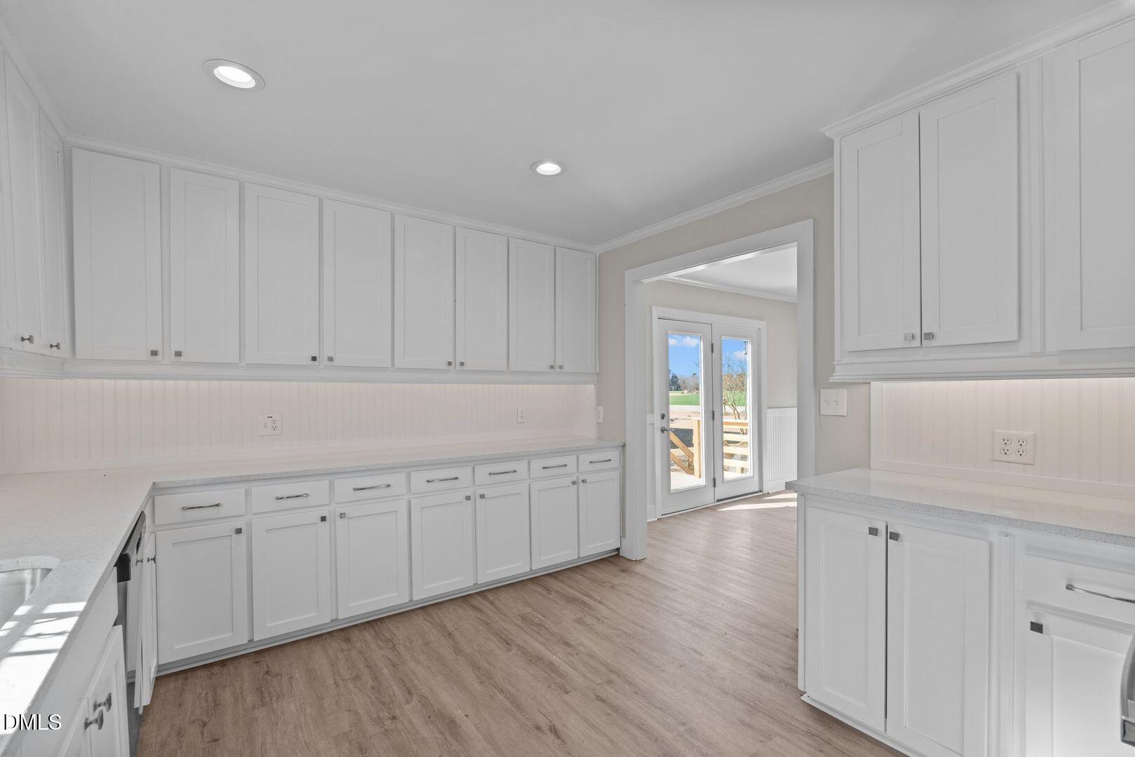 1920 Green Path Road Dunn, NC 28334 - Photo 20 of 30 a room with white cabinets and wooden floor