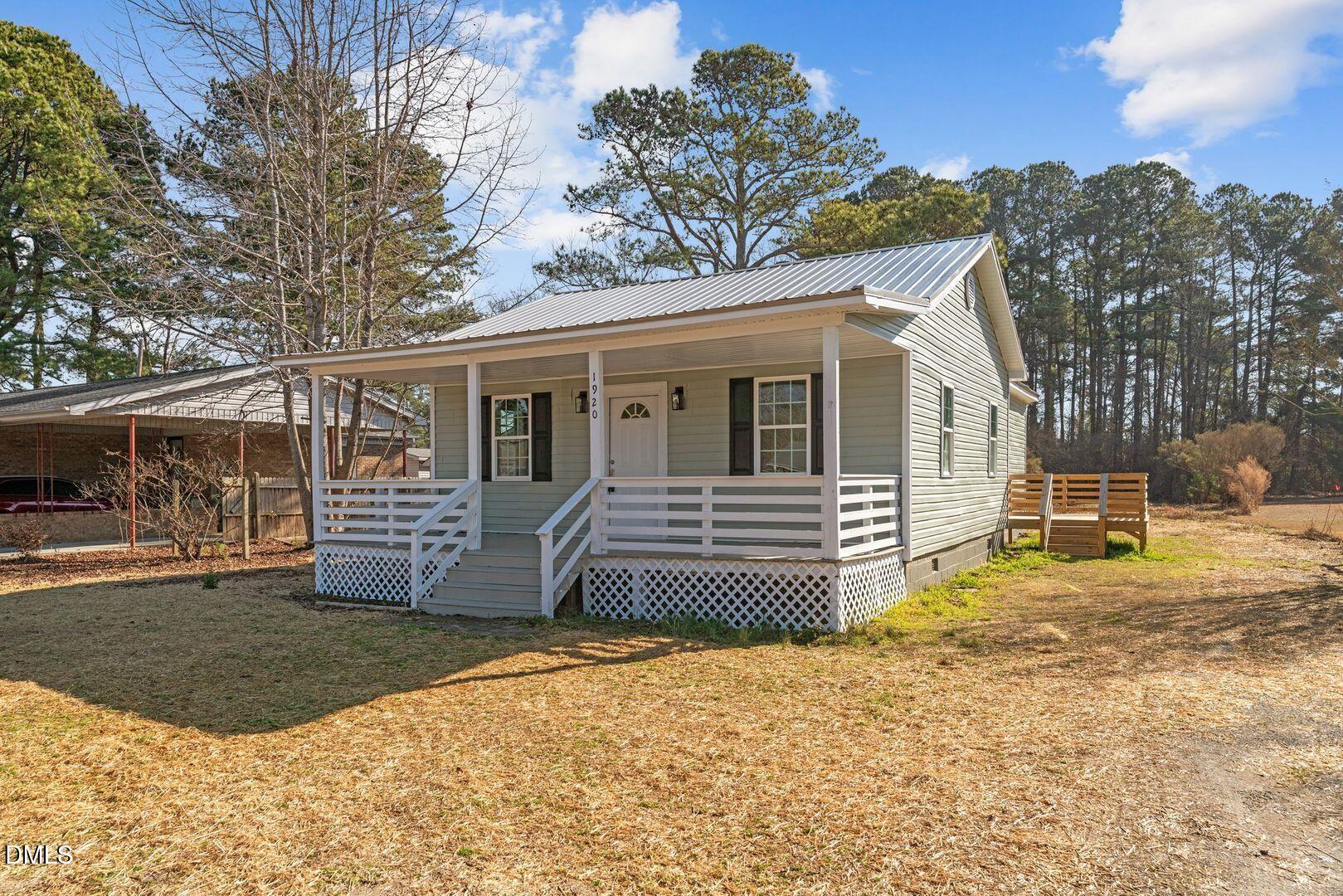 1920 Green Path Road Dunn, NC 28334 - Photo 2 of 30 a front view of a house with garden