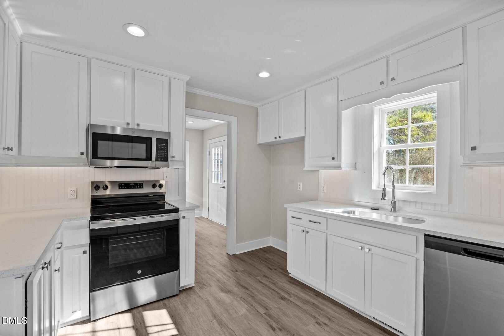 1920 Green Path Road Dunn, NC 28334 - Photo 21 of 30 a kitchen with a sink stove and microwave