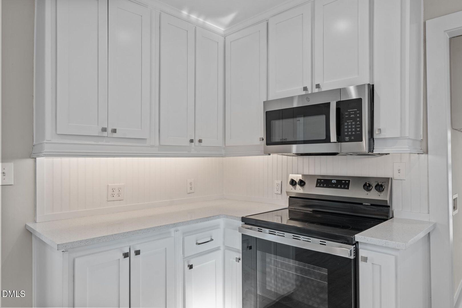 1920 Green Path Road Dunn, NC 28334 - Photo 26 of 30 a kitchen with appliances a sink and cabinets