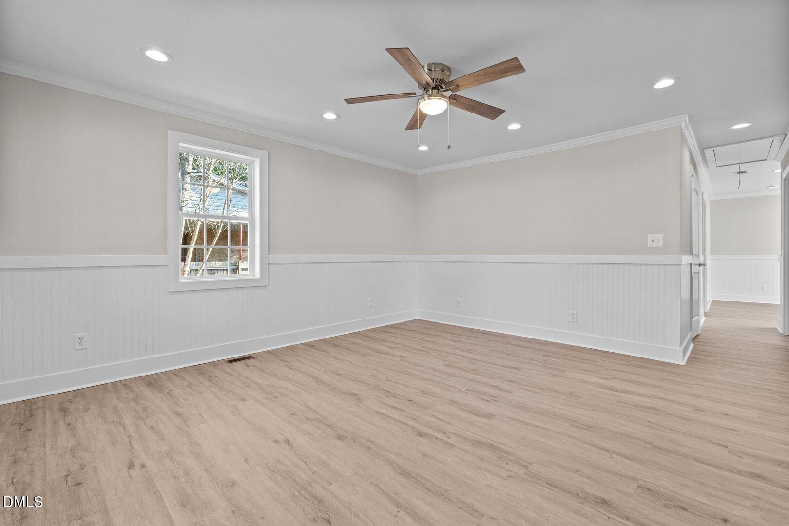 1920 Green Path Road Dunn, NC 28334 - Photo 3 of 30 an empty room with wooden floor fan and windows
