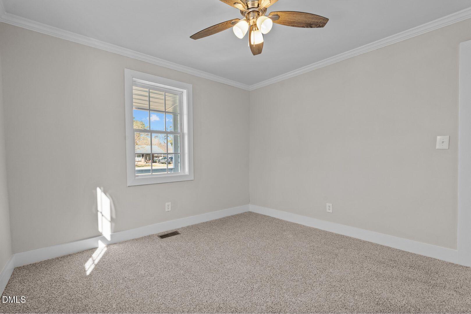 1920 Green Path Road Dunn, NC 28334 - Photo 8 of 30 an empty room with a window