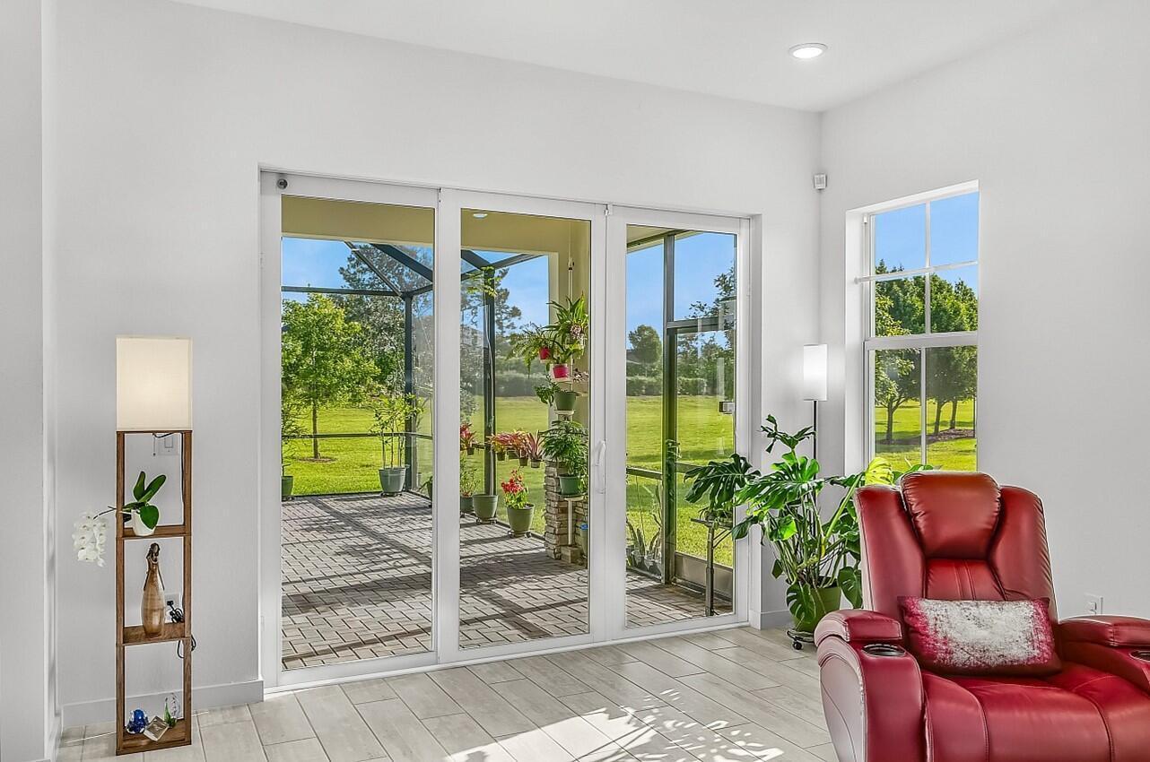 19567 Weathervane Way Loxahatchee, FL 33470 - Photo 14 of 49 a outdoor living space with furniture and a potted plant