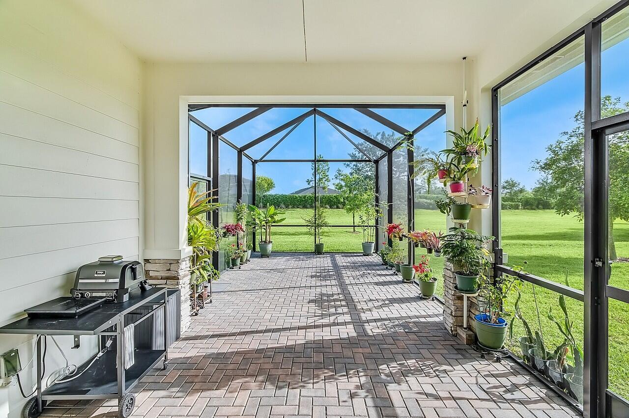 19567 Weathervane Way Loxahatchee, FL 33470 - Photo 25 of 49 a view of a backyard with sitting area