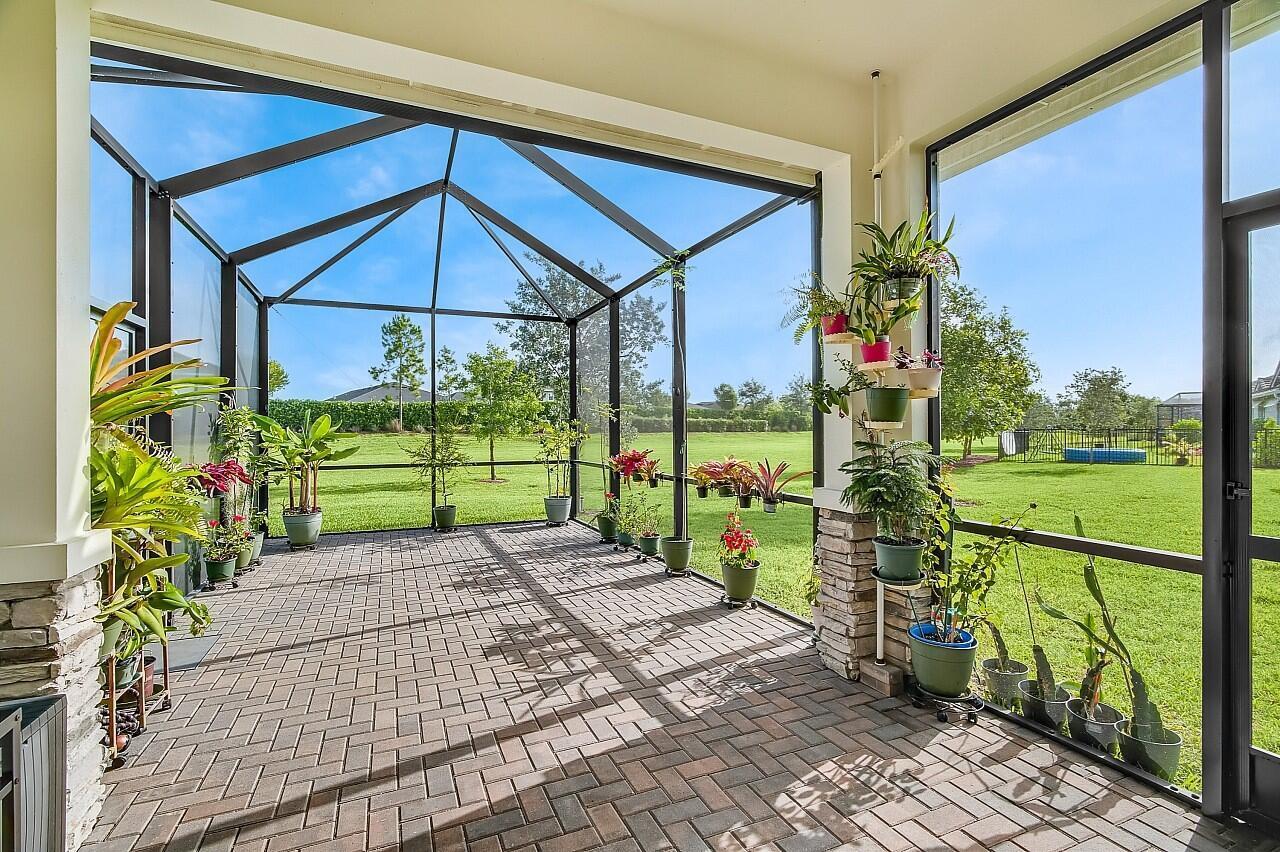 19567 Weathervane Way Loxahatchee, FL 33470 - Photo 26 of 49 a view of a house with backyard and porch