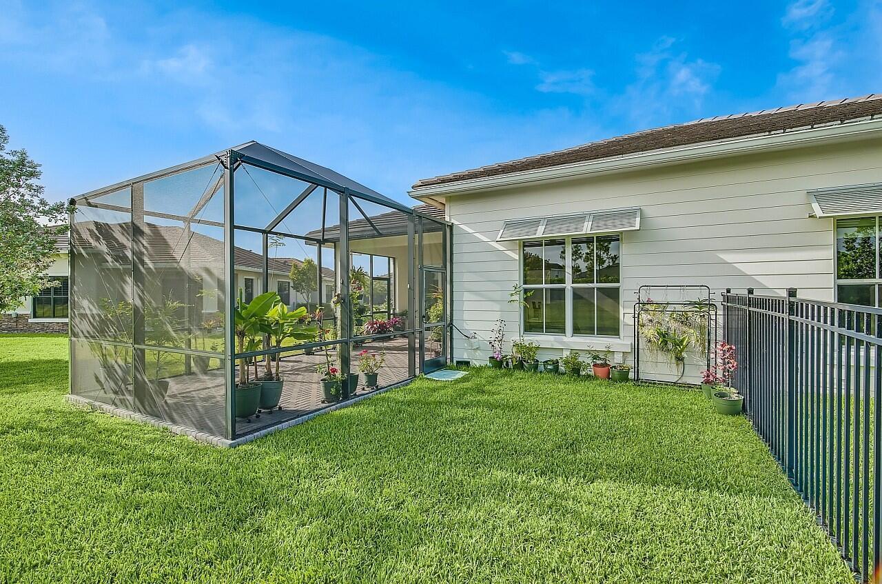 19567 Weathervane Way Loxahatchee, FL 33470 - Photo 29 of 49 a view of a house with a yard and porch