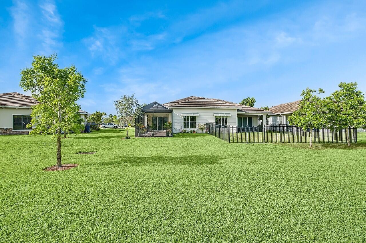 19567 Weathervane Way Loxahatchee, FL 33470 - Photo 30 of 49 a front view of a house with a yard