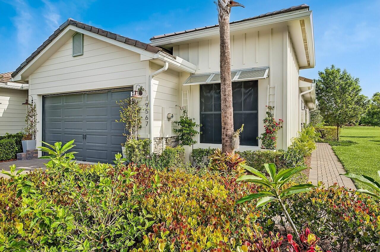 19567 Weathervane Way Loxahatchee, FL 33470 - Photo 3 of 49 front view of a house with a yard