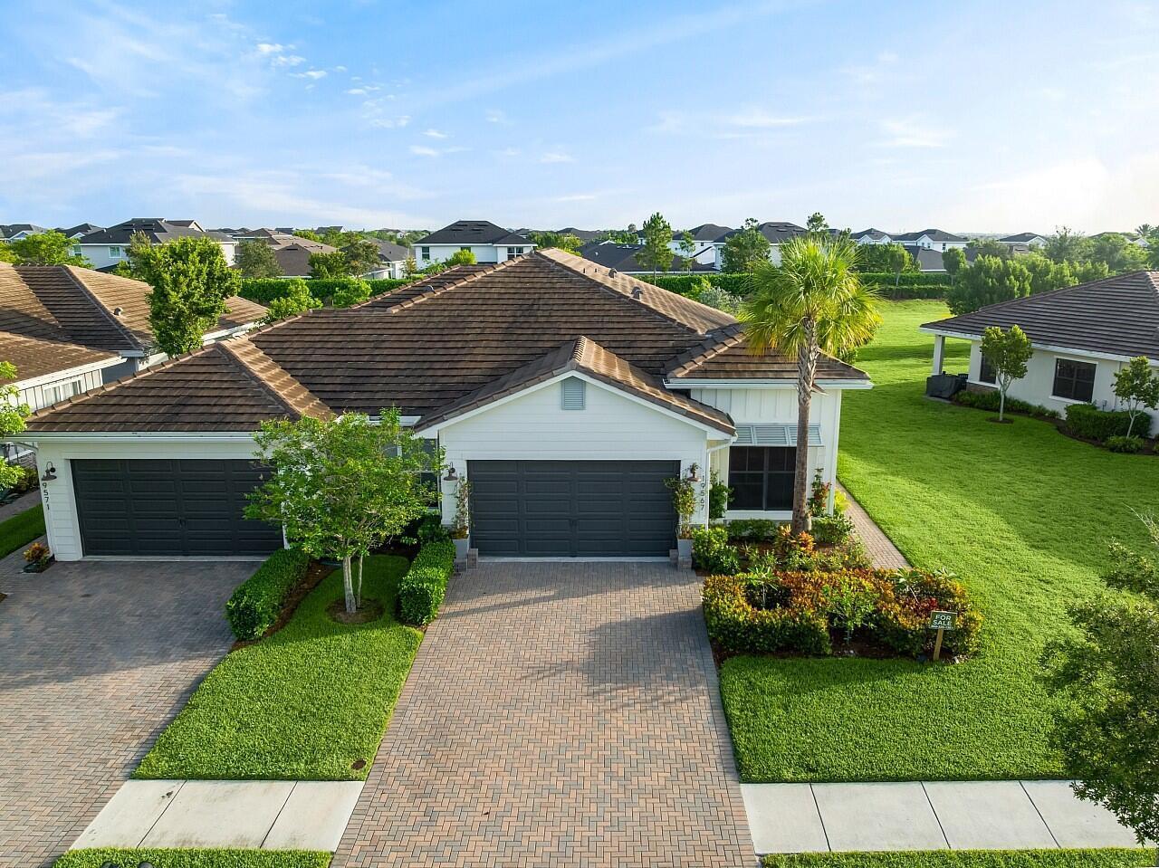 19567 Weathervane Way Loxahatchee, FL 33470 - Photo 34 of 49 a front view of a house with garden