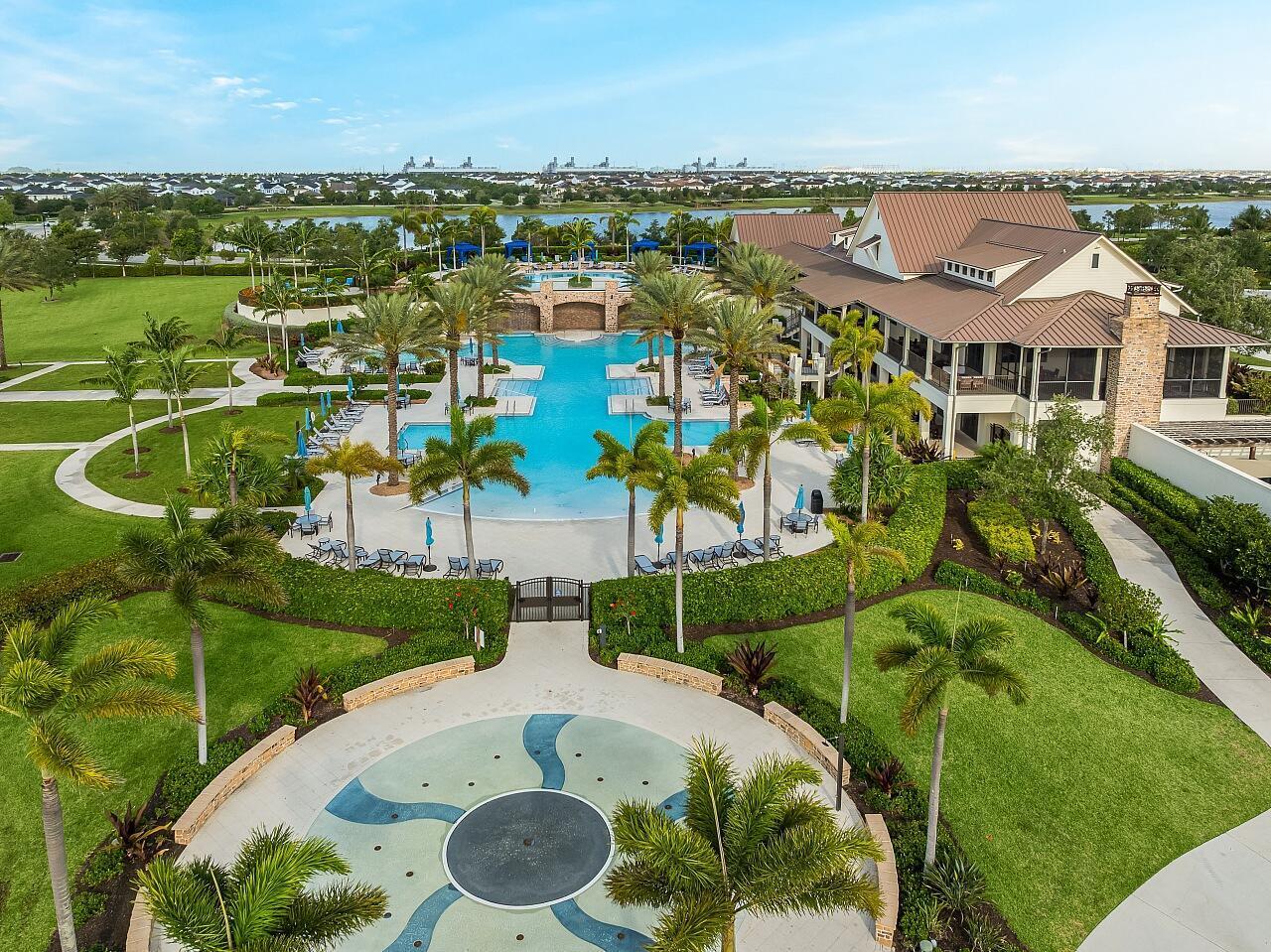 19567 Weathervane Way Loxahatchee, FL 33470 - Photo 36 of 49 an aerial view of a house with a garden and lake view
