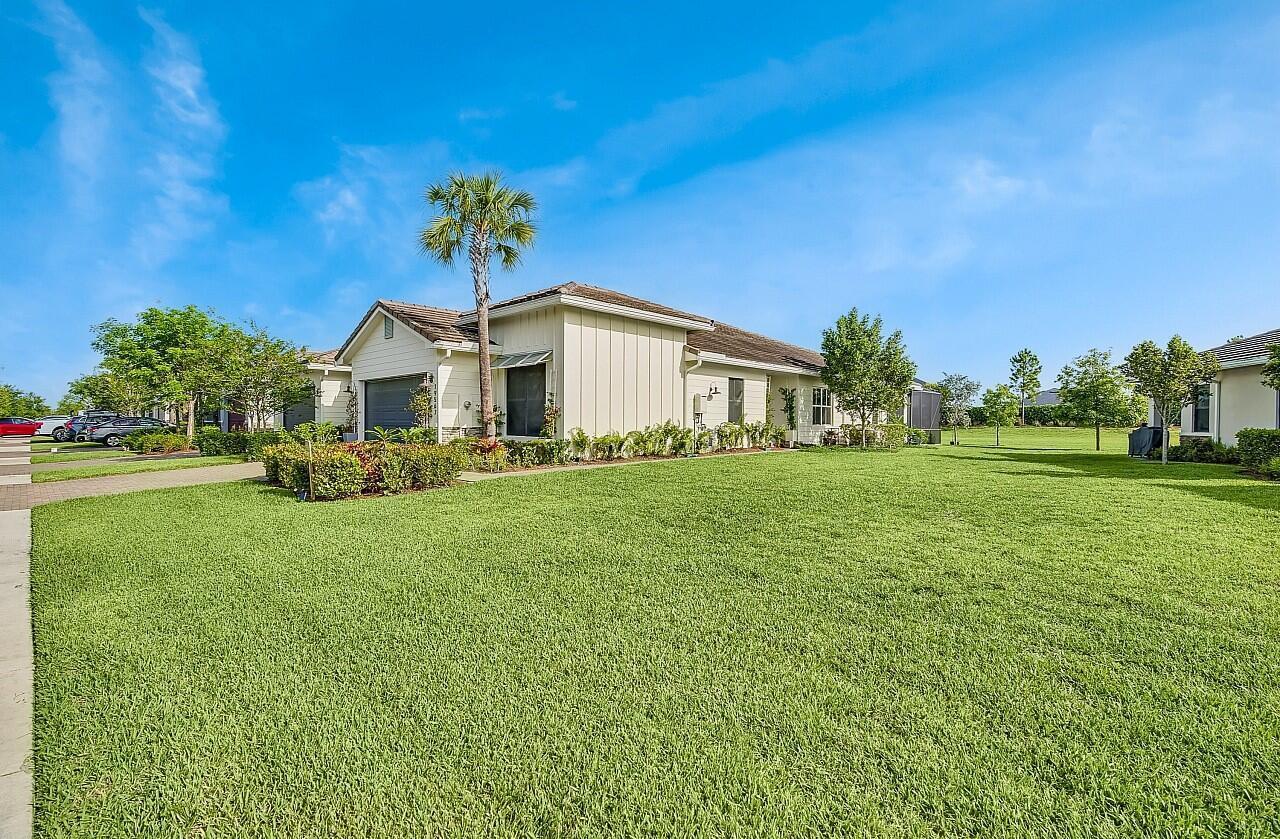 19567 Weathervane Way Loxahatchee, FL 33470 - Photo 4 of 49 a front view of a house with garden