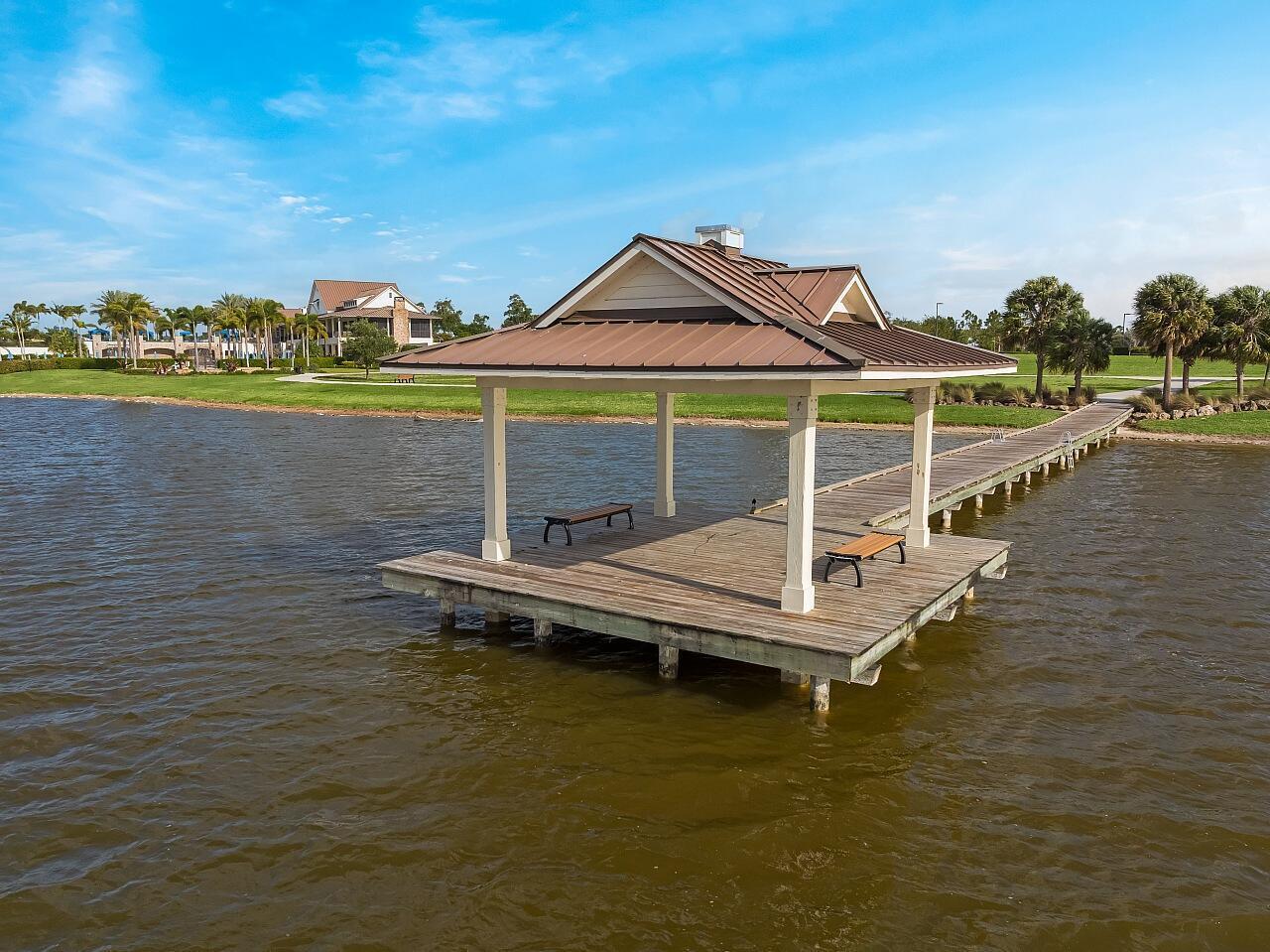 19567 Weathervane Way Loxahatchee, FL 33470 - Photo 49 of 49 a view of a lake with a terrace