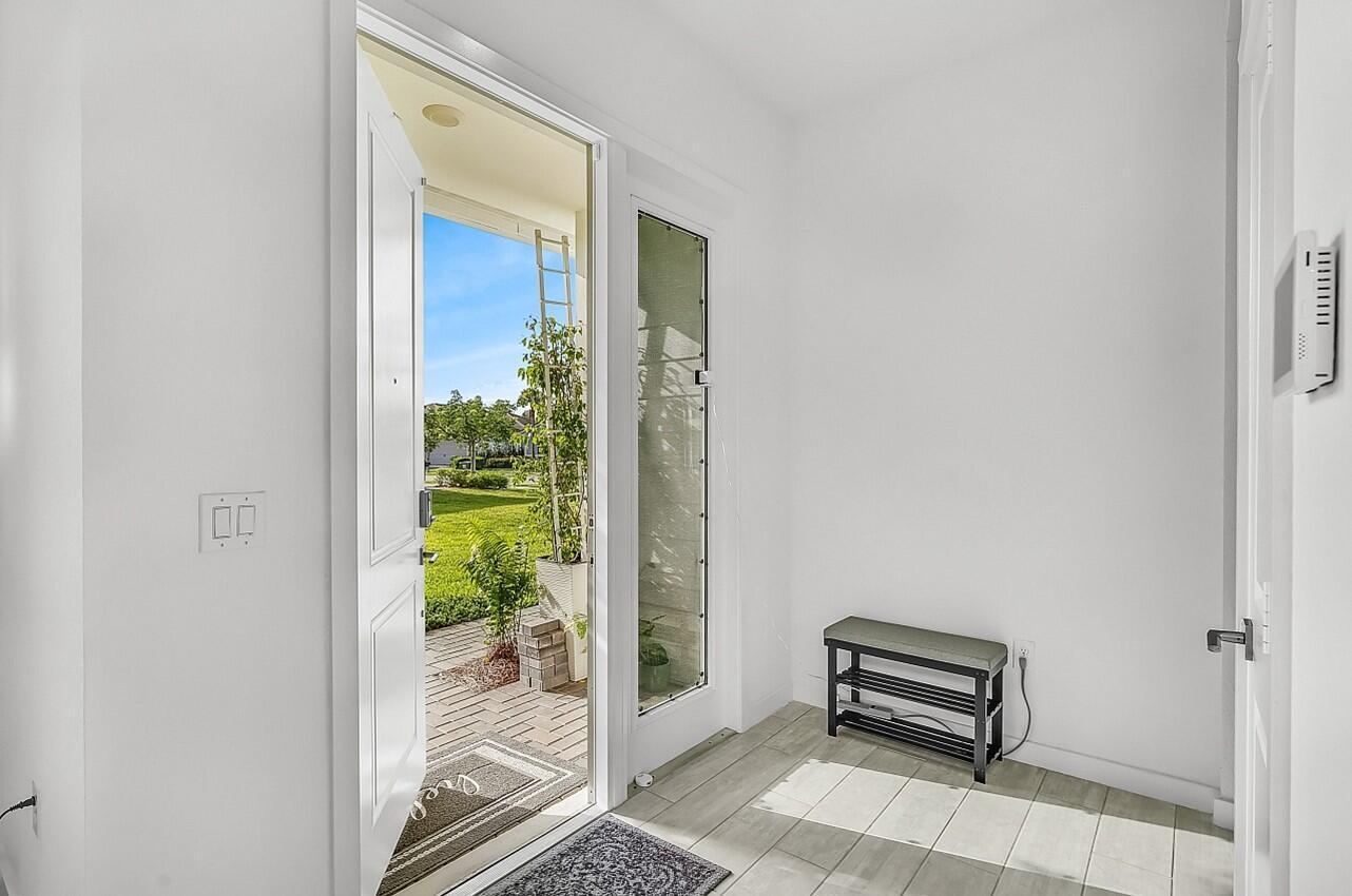 19567 Weathervane Way Loxahatchee, FL 33470 - Photo 5 of 49 a view of a balcony with wooden floor and a bench