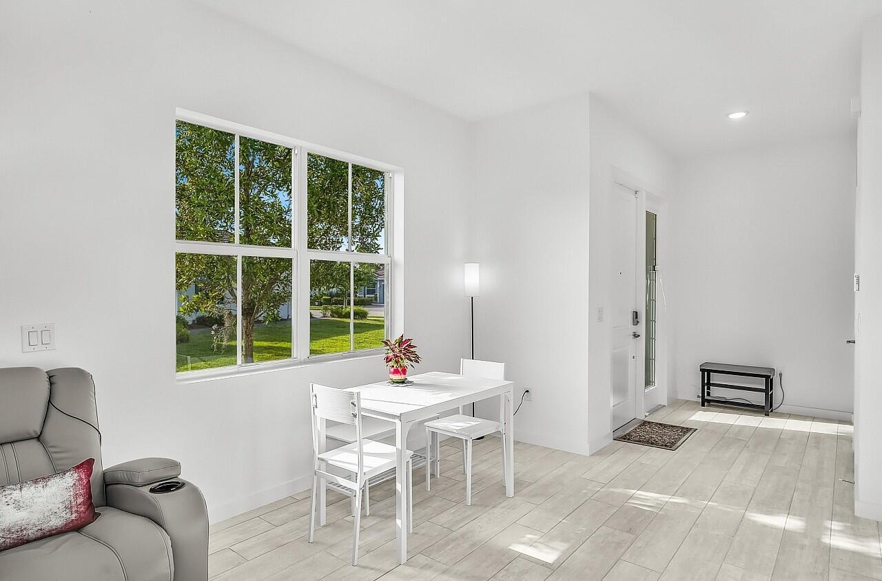 19567 Weathervane Way Loxahatchee, FL 33470 - Photo 6 of 49 a dining room with furniture and window
