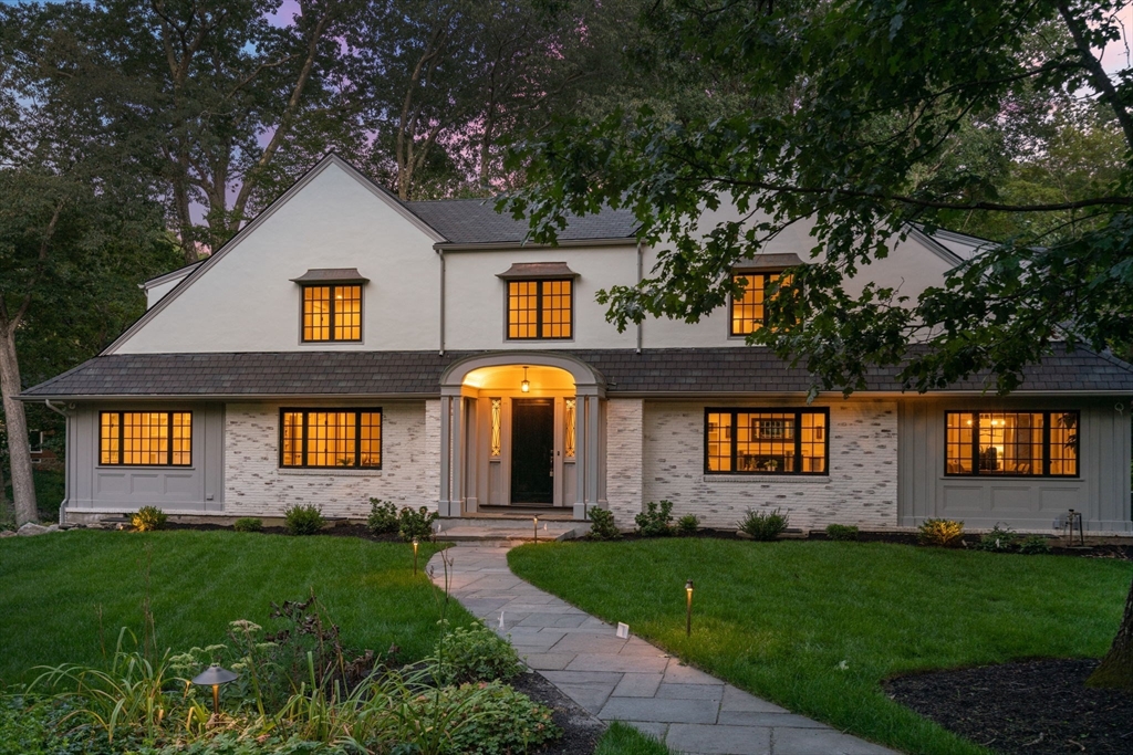 a front view of house and yard with green space