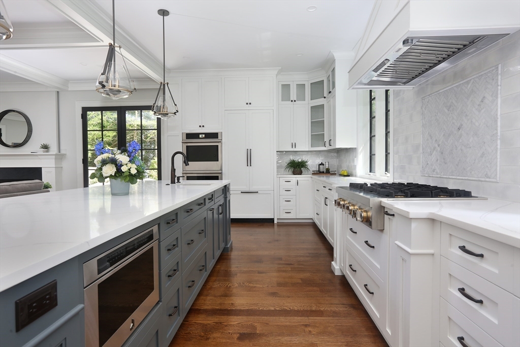 194 Hobart Road Newton, MA 02467 - Photo 12 of 37 a kitchen with stainless steel appliances granite countertop a sink a stove and a refrigerator