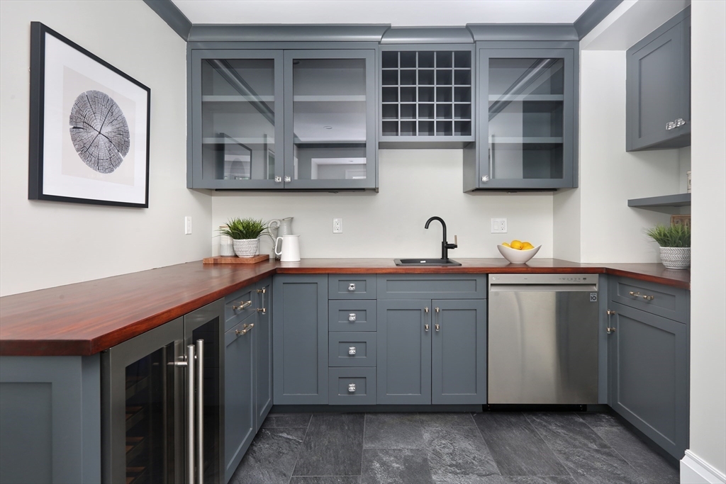 194 Hobart Road Newton, MA 02467 - Photo 13 of 37 a kitchen with stainless steel appliances granite countertop a sink and cabinets