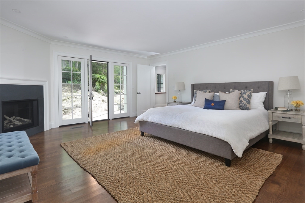 194 Hobart Road Newton, MA 02467 - Photo 16 of 37 a spacious bedroom with a bed and a couch