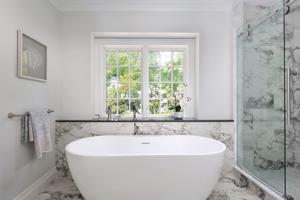 194 Hobart Road Newton, MA 02467 - Photo 18 of 37 a white bath tub sitting in a bathroom next to a window
