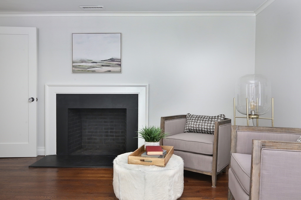 194 Hobart Road Newton, MA 02467 - Photo 23 of 37 a living room with furniture and a fireplace