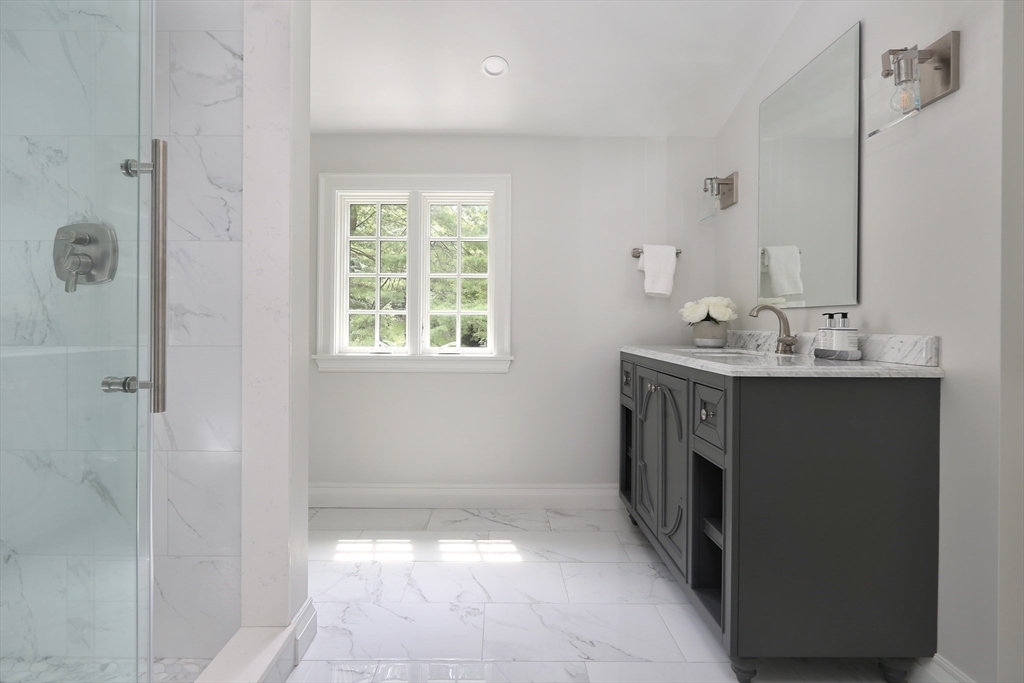 194 Hobart Road Newton, MA 02467 - Photo 24 of 37 a utility room with a sink a washer and dryer
