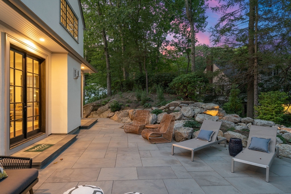 194 Hobart Road Newton, MA 02467 - Photo 29 of 37 a backyard of a house with outdoor seating