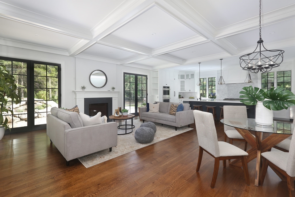 194 Hobart Road Newton, MA 02467 - Photo 5 of 37 a living room with furniture a fireplace and a large window