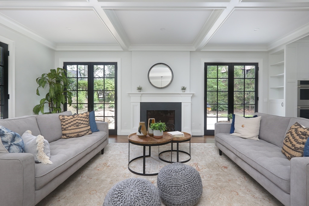 194 Hobart Road Newton, MA 02467 - Photo 6 of 37 a living room with furniture a fireplace and a large window
