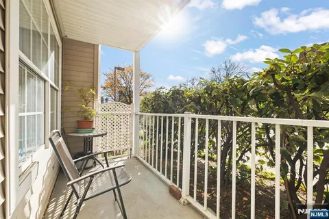 a view of a balcony with chair