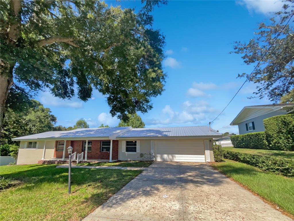 1905 Manor Circle Southeast Winter Haven, FL 33880 - Photo 1 of 1 front view of a house with a yard