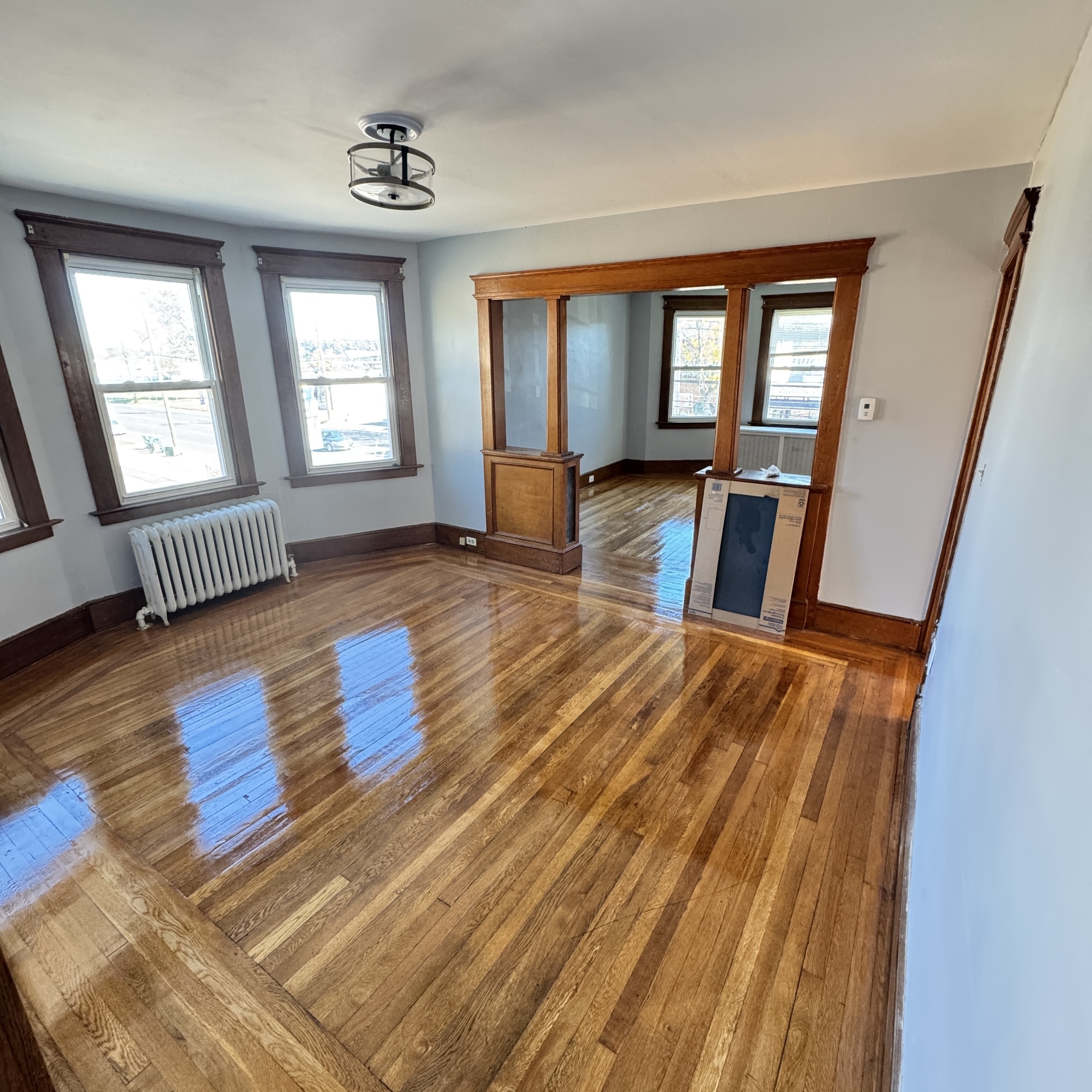 wooden floor with windows and hardwood floor