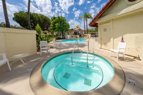 a view of a swimming pool with a patio