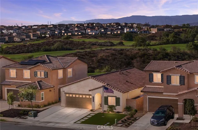 a view of multiple houses with a city street