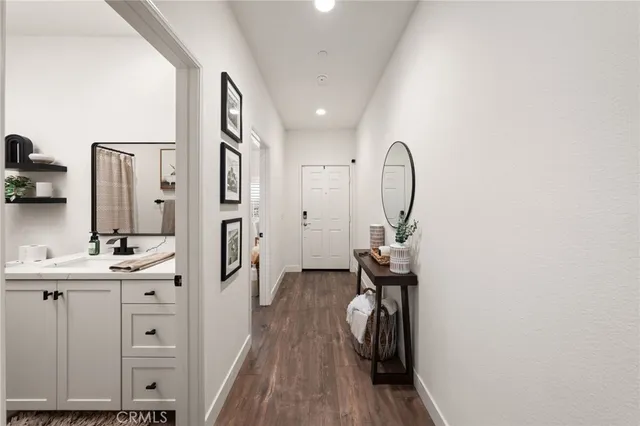 a view of a bathroom with dual sinks