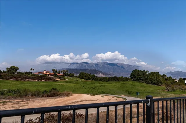 a view of balcony with wooden floor and lake view