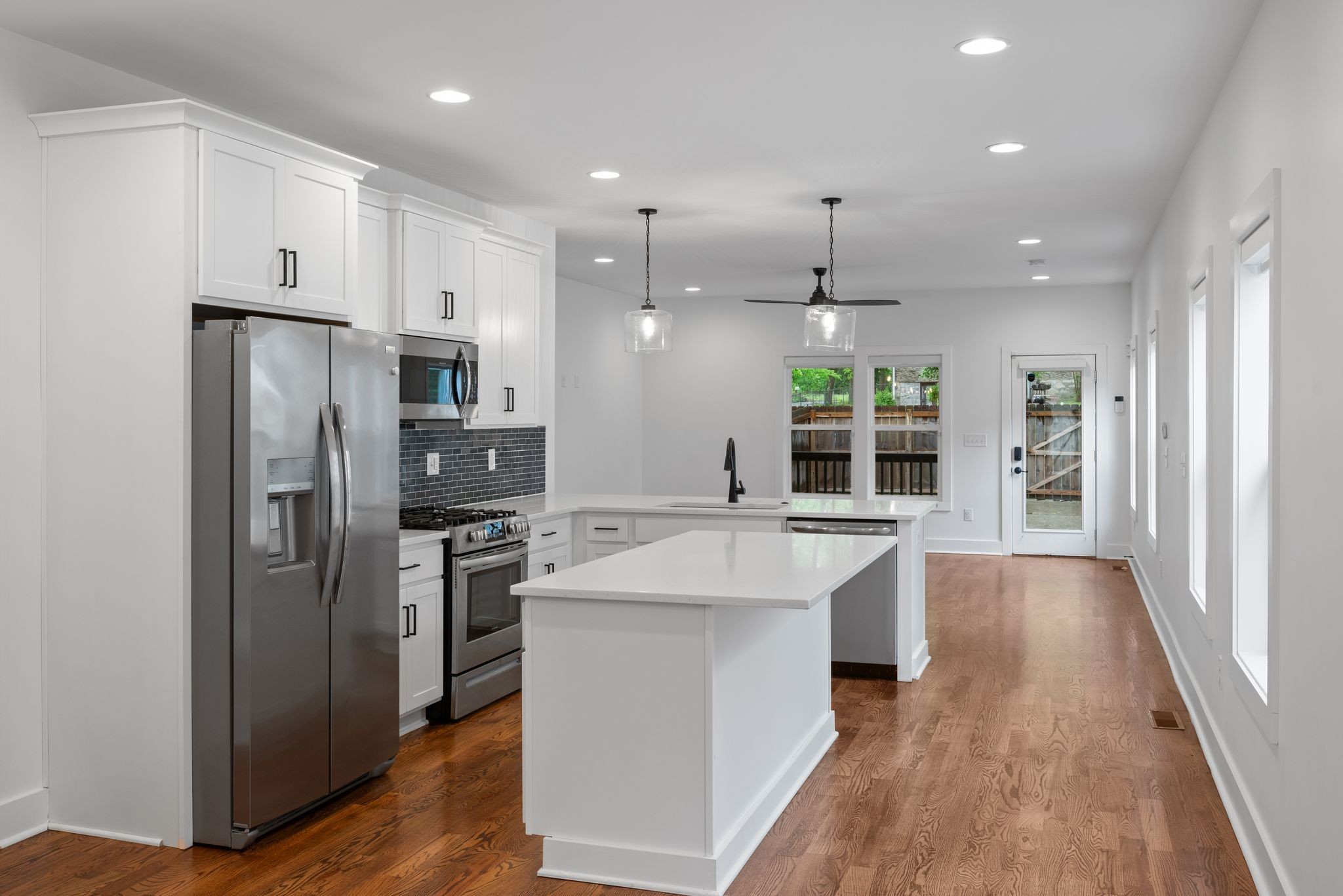 1305 A Lischey Avenue Nashville, TN 37207 - Photo 11 of 30 a kitchen with kitchen island a sink stove and refrigerator