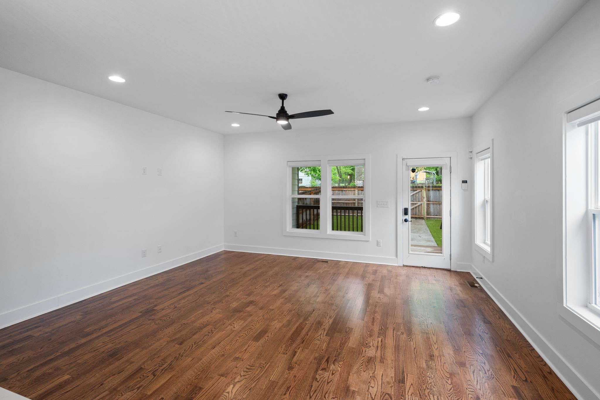 1305 A Lischey Avenue Nashville, TN 37207 - Photo 16 of 30 a view of an empty room with a window and wooden floor