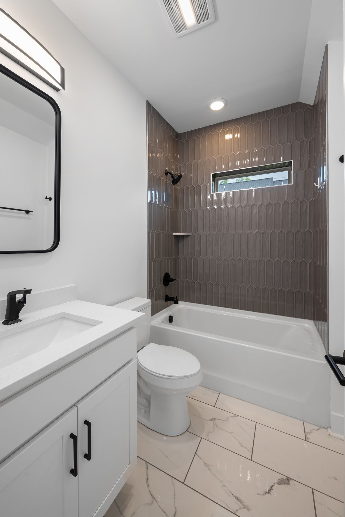 1305 A Lischey Avenue Nashville, TN 37207 - Photo 23 of 30 a bathroom with a sink a toilet and shower