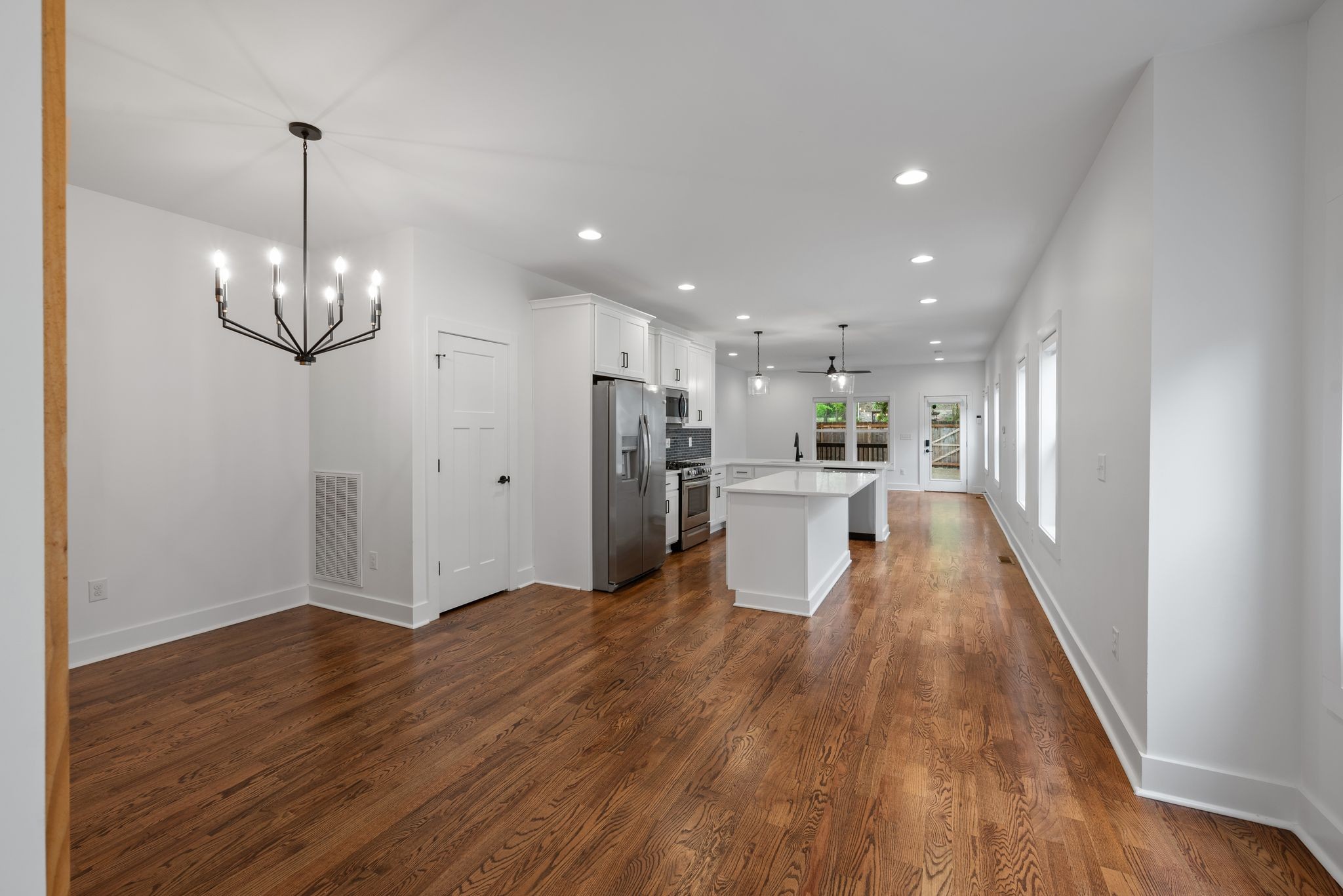 1305 A Lischey Avenue Nashville, TN 37207 - Photo 8 of 30 a view of a living room and kitchen with wooden floor