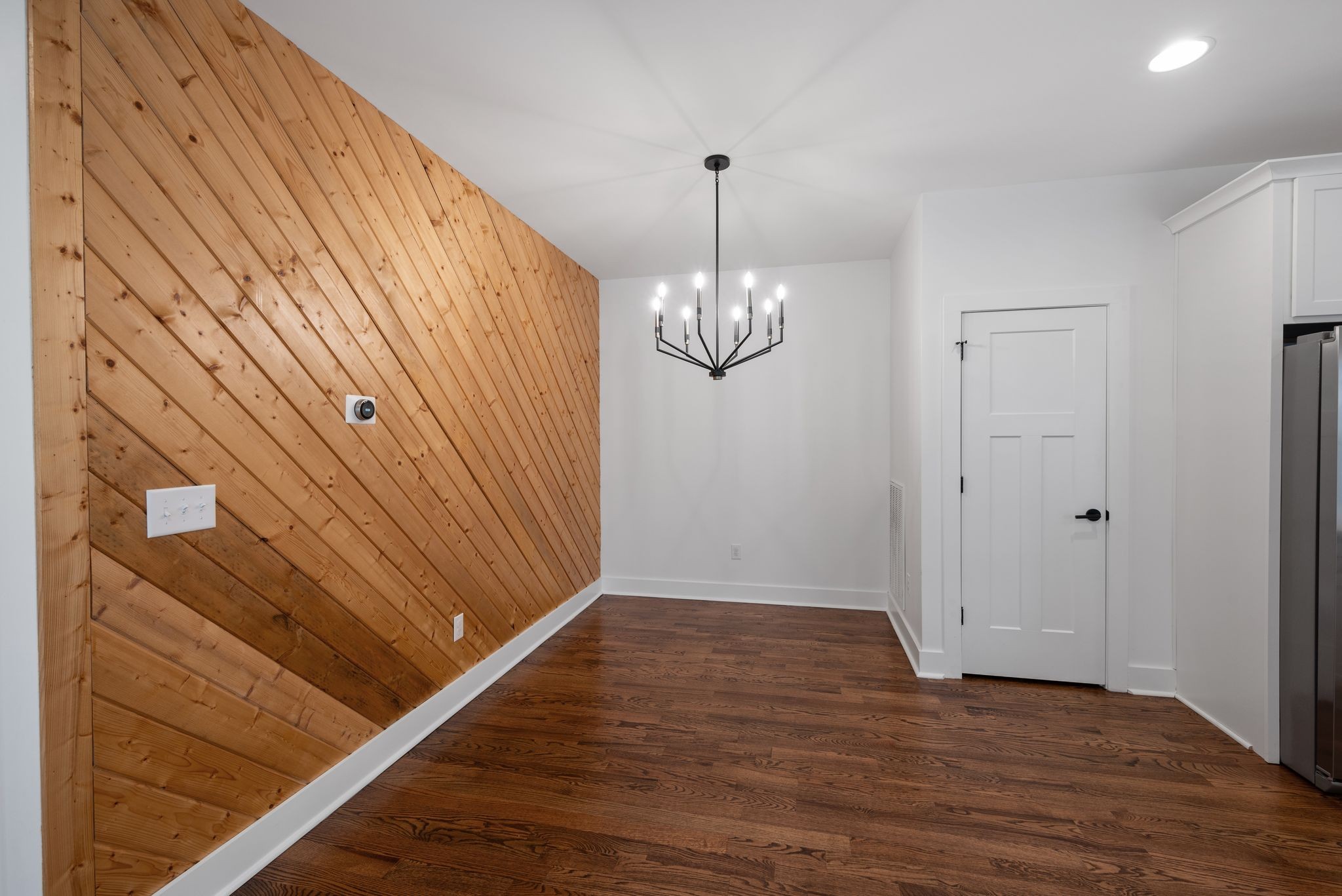 1305 A Lischey Avenue Nashville, TN 37207 - Photo 9 of 30 a view of a room with wooden floor and chandelier