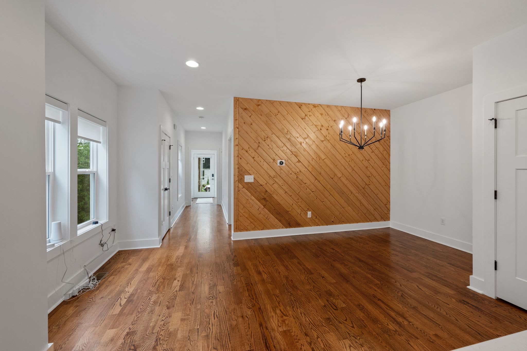1305 A Lischey Avenue Nashville, TN 37207 - Photo 10 of 30 a view of an empty room with wooden floor and a window