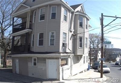 6 Poplar Street Waterbury, CT 06708 - Photo 1 of 1 a view of a house with a balcony