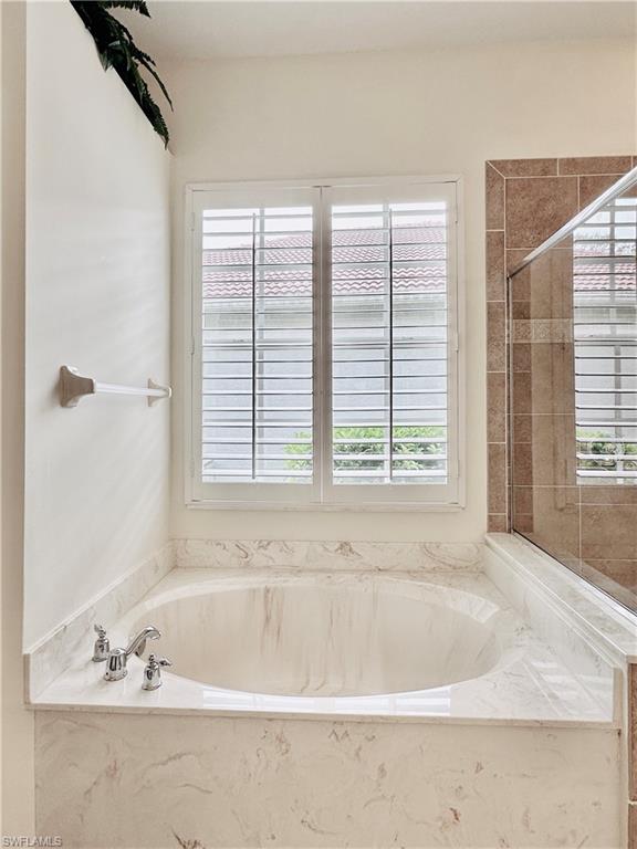 16152 Parque Lane Naples, FL 34110 - Photo 20 of 49 Bathroom with separate shower and tub