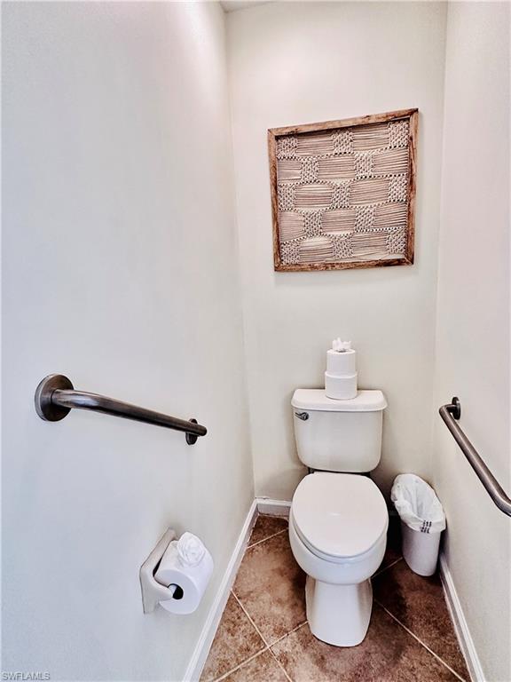 16152 Parque Lane Naples, FL 34110 - Photo 21 of 49 Bathroom featuring toilet and tile patterned flooring